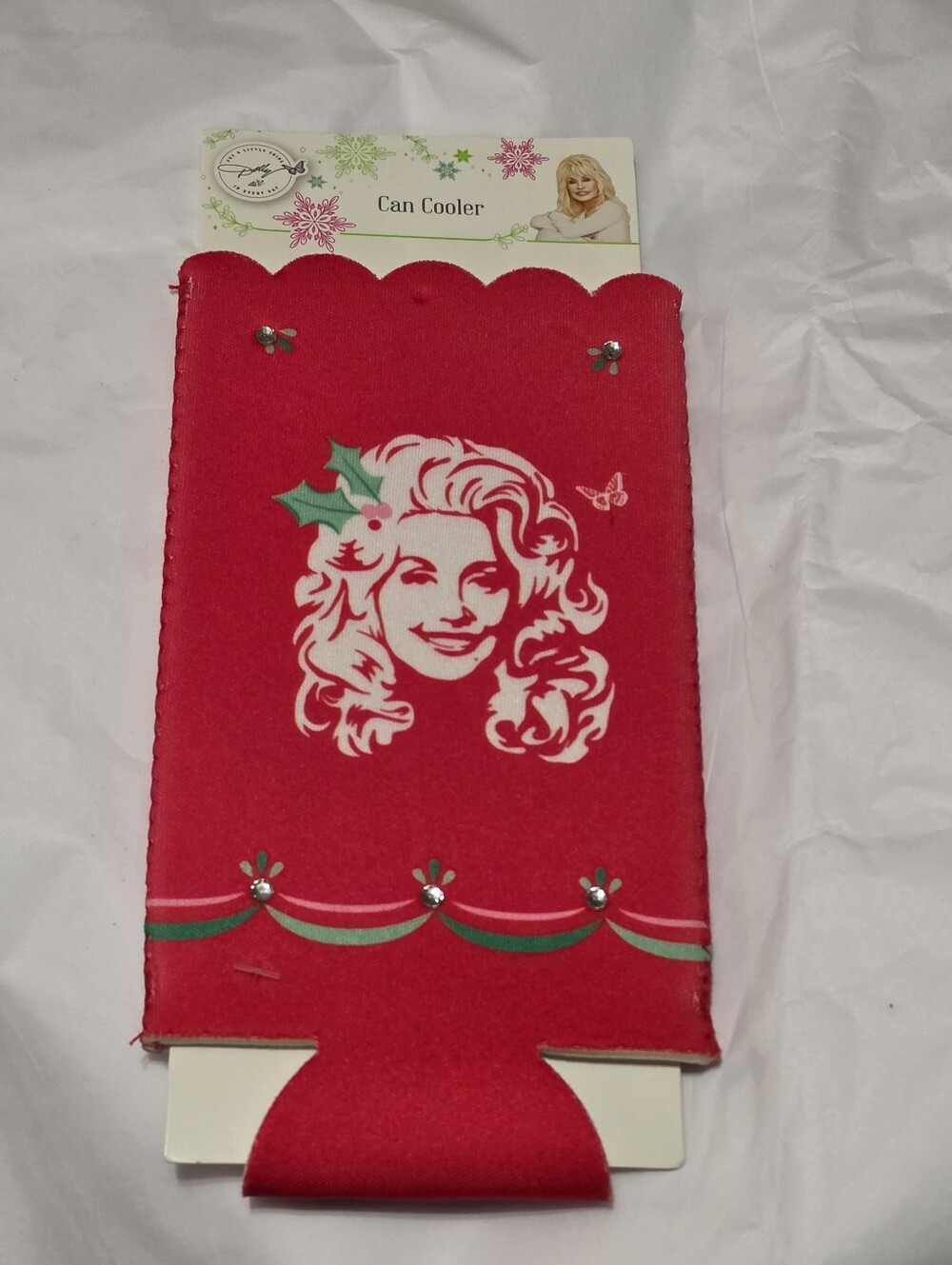 Dolly Parton. Holiday Red Can Cooler with Festive Portrait. Koosie